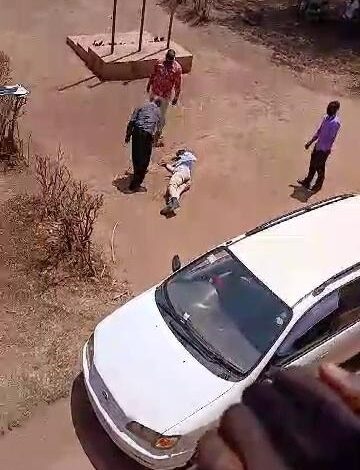 A savage and uncouth Director St. James Lira School of Nursing flogging a man at his institute.